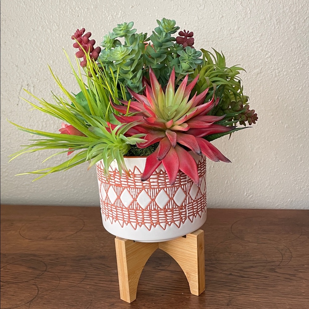 Contemporary Faux Succulent Mix in a Burnt Orange and White Ceramic Footed Vase